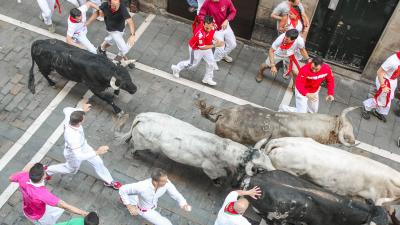 Experience the San Fermín bull running from a balcony